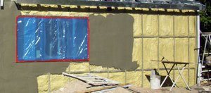 Installation of ExoStructure w/insulation around existing building Installation of ExoStructure w/insulation around existing building