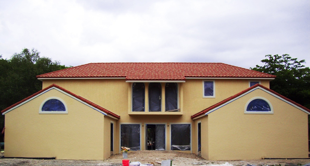 Rebuilt with an am-cor Ferrocement Exostructure after a fire, this FL home is also hurricane-resistant & flood-resistant